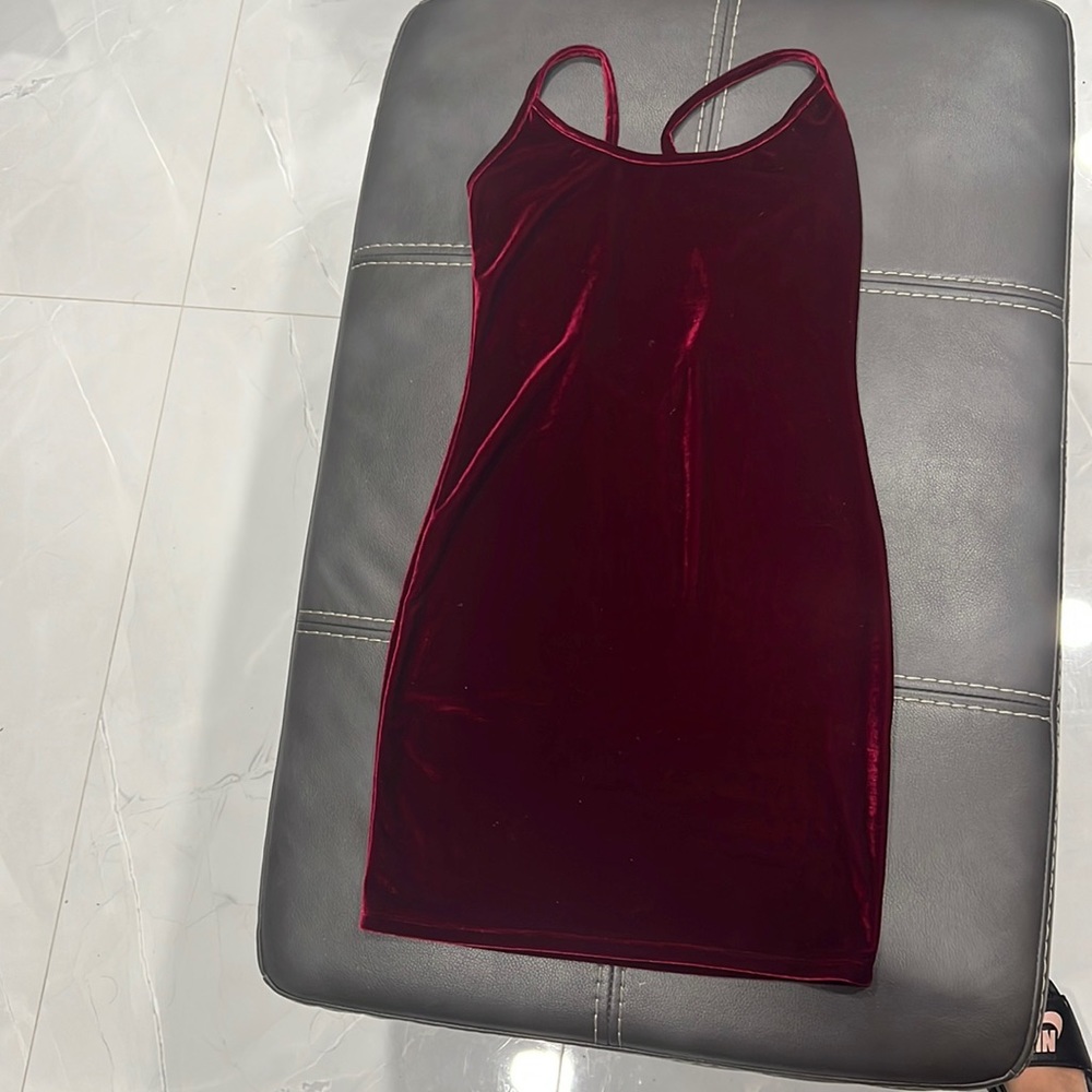 Worn once red velvet dress with back out. Size M Forever 21